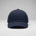 Simple navy blue baseball cap on gray background Royalty Free Stock Photo