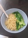 Simple noodle with green vegetable in a bowl