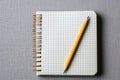 A simple notepad with a pencil on top. Suitable for office, education, or creative concepts Royalty Free Stock Photo