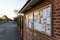Notice board on brick wall Royalty Free Stock Photo
