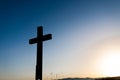 Simple oak wood catholic cross silhouette at sunset, dramatic dark blue Royalty Free Stock Photo