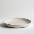Minimalist ceramic plate on a white background Royalty Free Stock Photo