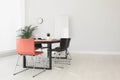 Simple office interior with table and chairs