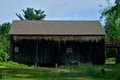 Simple old wood barn beneath deep blue sky