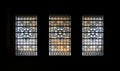 Simple patterned antique stained glass window silhouettes frame on black background in The national gallery Royalty Free Stock Photo