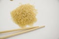 Simple photo of rice and wooden chopsticks