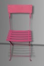 Simple pink metal and wood chair