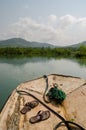 Simple plastic raft traversing mangrove forests in wetlands near Tokeh Beach, Sierra Leone, Africa Royalty Free Stock Photo