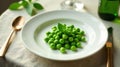 A simple plate of fresh, vibrant green peas garnished with a delicate sprig of mint, elegantly presented for a refined dining Royalty Free Stock Photo