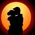 silhouette of a couple embracing in a warm and affectionate hug.