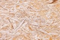 Simple pressed chipboard pattern. Chip board background. Brown wood texture Royalty Free Stock Photo