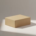 A simple rectangular cardboard box is placed on a clean, neutral background. The box Royalty Free Stock Photo
