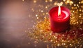 Simple red Christmas burning candle on some golden confetti