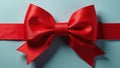 A simple red grosgrain bow with a smaller red bow atop , celebration, still life, bright Royalty Free Stock Photo