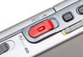 Simple red REC audio recording button, recorder device switch on a portable sound recorder, detail, extreme closeup, nobody