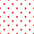 Simple romantic seamless pattern with repeating red hearts on white background.