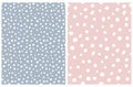 White Hand Drawn Brush Dots Isolated on a Pale Blue and Pastel Pink Background. Royalty Free Stock Photo