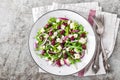 Simple salad with arugula, beans, soft cheese, onions and oil