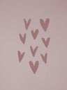 Simple Scandinavian Style Composition with Little Paper Hearts of Irregular Shape.