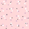 Simple seamless pattern with colored round spots. Pink, lilac, white, black.