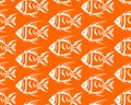 simple seamless pattern of white graphic fish on an orange background Royalty Free Stock Photo