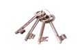 A simple set of 4 old worn metal keys on one keychain, object isolated on white, cut out, nobody. Prison jail cell keys key chain Royalty Free Stock Photo