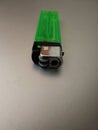 Close up of simple small green gas lighter Royalty Free Stock Photo