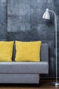 Simple sofa with yellow pillows Royalty Free Stock Photo