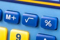 Simple square root symbol button on a colorful calculator keypad macro, closeup. Basic algebra symbols, easy math nomenclature Royalty Free Stock Photo