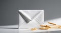 Simple Still Life Composition of White Envelope and Wheat Stalks on a Gray Background. Royalty Free Stock Photo