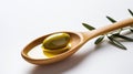 simple still life with spoon filled with olive oil and olives and leaves from olive tree as decortation