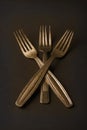 Simple still life of three gold vintage forks Royalty Free Stock Photo