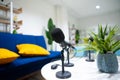 Simple studio room with blue chairs. Podcast media studio to broadcast audio