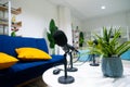 Simple studio room with blue chairs. Podcast media studio to broadcast audio