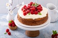 Simple summer cake with raspberries and frosting