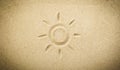 Sun Drawn in Soft Beach Sand â Summer Fun and Vacation Symbol. Sand background with copy space. Royalty Free Stock Photo