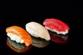 Simple sushi nigiri maki set isolated on black background. Various selection of traditional japanese food Royalty Free Stock Photo