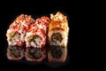 Simple sushi nigiri maki set isolated on black background. Various selection of traditional japanese Royalty Free Stock Photo