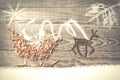 Simple symbols of Father Christmas sleigh arranged from sawdust Royalty Free Stock Photo