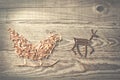 Simple symbols of Father Christmas sleigh arranged from sawdust Royalty Free Stock Photo