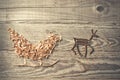 Simple symbols of Father Christmas sleigh arranged from sawdust Royalty Free Stock Photo