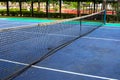 Simple tennis court outdoor in summer town. Tennis club outdoor. Summer sport and active lifestyle