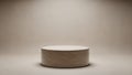Simple Cylindrical White Platform or Pedestal with a Textured Surface and Soft Lighting Against a Neutral Beige Background Royalty Free Stock Photo