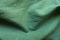simple juniper green cotton fabric in soft folds Royalty Free Stock Photo