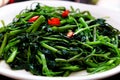 Simple vegan food for vegetarian meal, water spinach fry with cooking oil Royalty Free Stock Photo