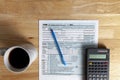 A simple versatile US federal income tax return concept image with an empty 1040 form on wooden table