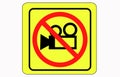 Simple video camera icon. No video recording signboard, black object in warning sign with YALLO background color Royalty Free Stock Photo