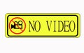 Simple video camera icon. No video recording signboard, black object in warning sign with YALLO background color Royalty Free Stock Photo