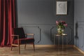 Simple waiting room interior with a single red armchair standing Royalty Free Stock Photo