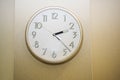 Simple wall clock. Wooden texture. Royalty Free Stock Photo